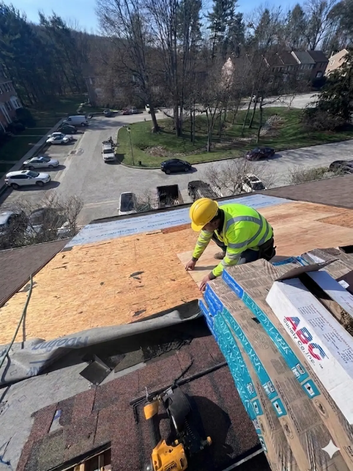 Crew member working on a residential roof repair