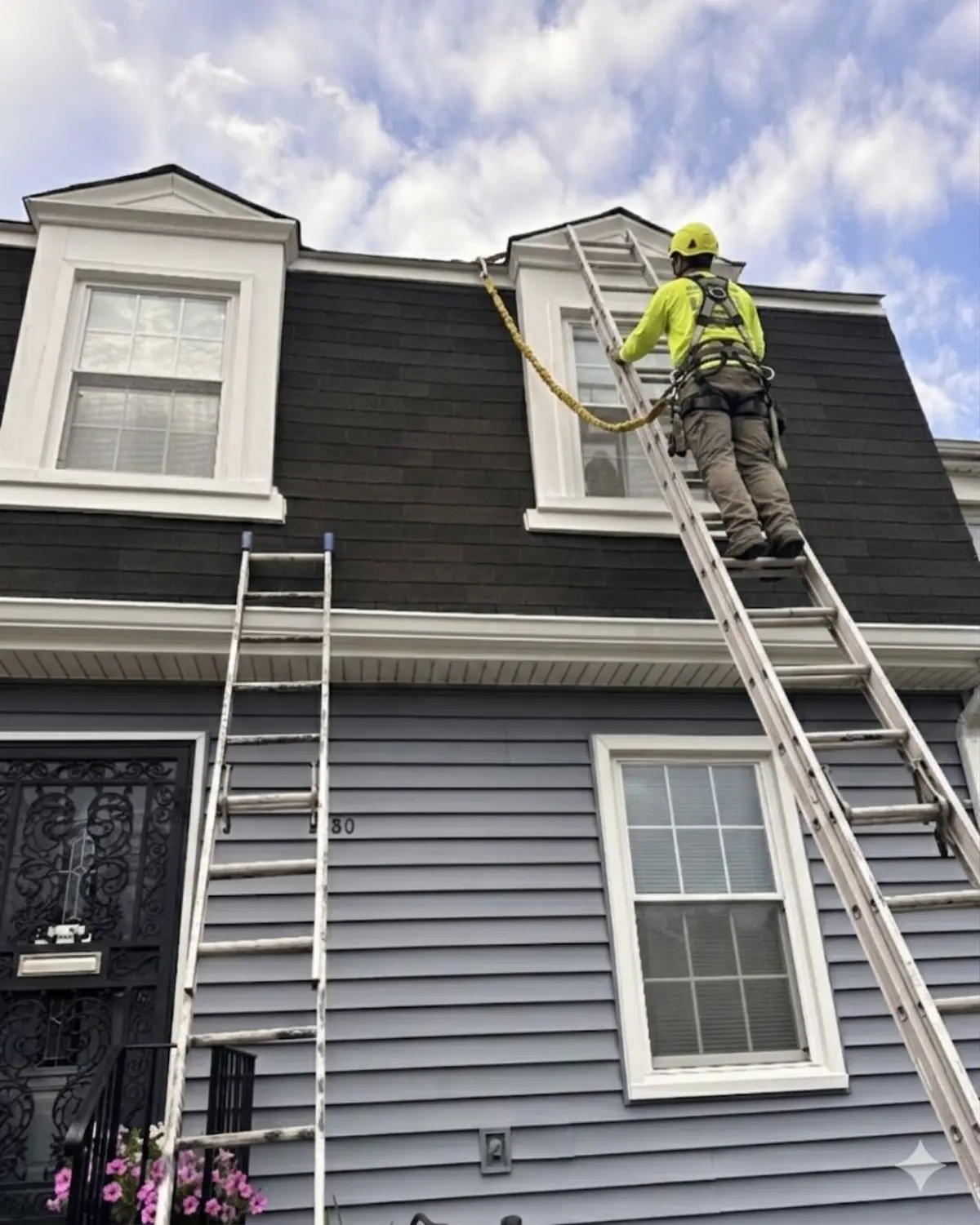 A crew member repairing a roof
